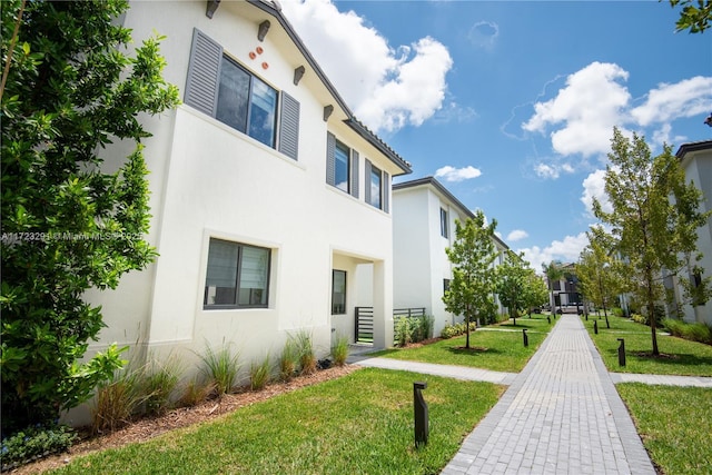 exterior space with a front yard