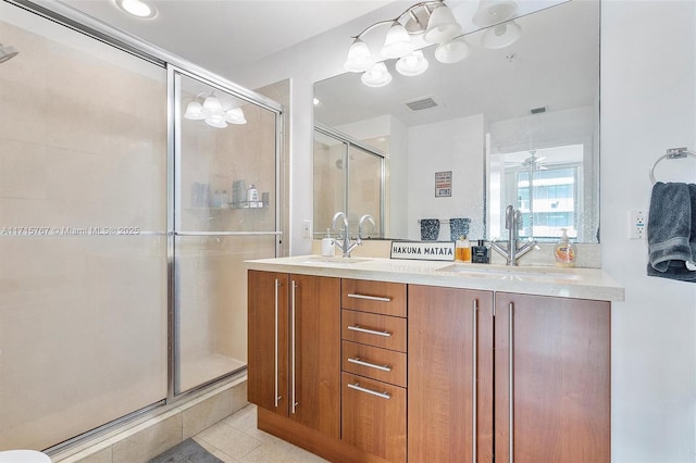 79 SW 12th St Unit 3809S, Miami, FL 33130 - bathroom featuring a stall shower, double vanity, and tile patterned floors
