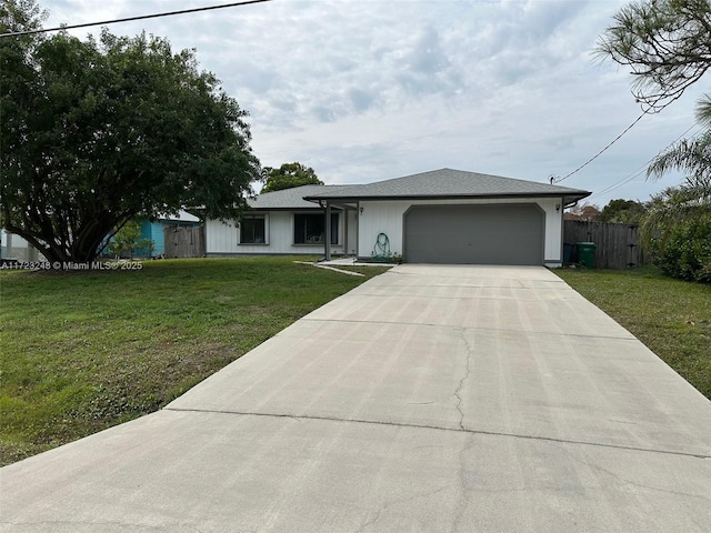 view of front of home featuring a front lawn and a garage