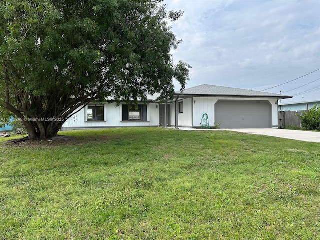 ranch-style house with a garage and a front yard