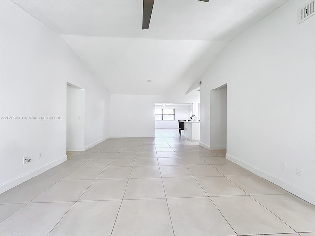 tiled spare room with high vaulted ceiling and ceiling fan