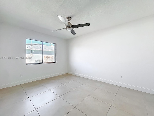 empty room with a textured ceiling and ceiling fan