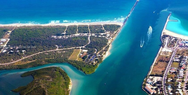 drone / aerial view with a water view and a view of the beach