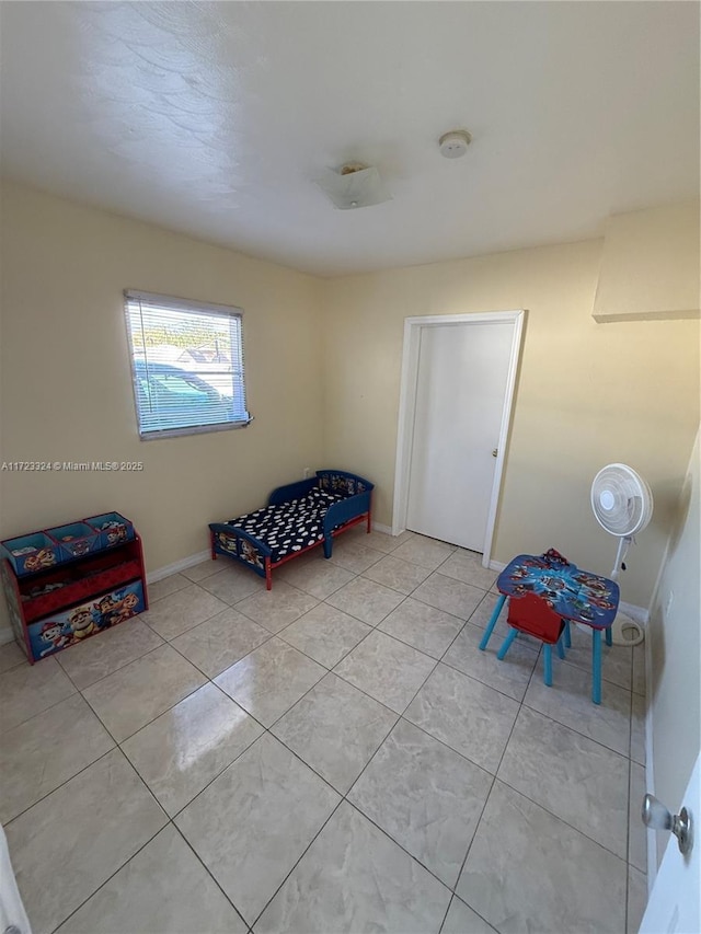 living area featuring light tile patterned floors