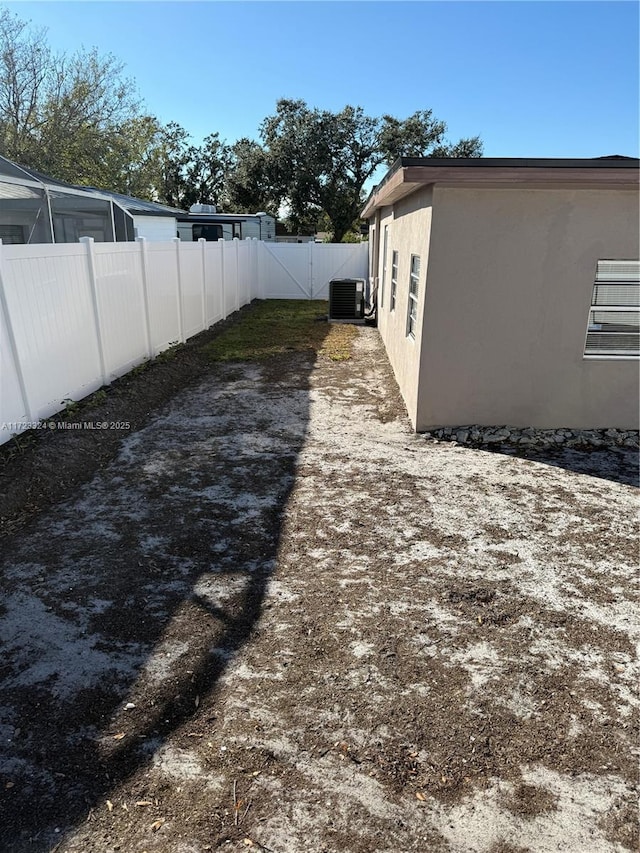 view of yard featuring central AC unit