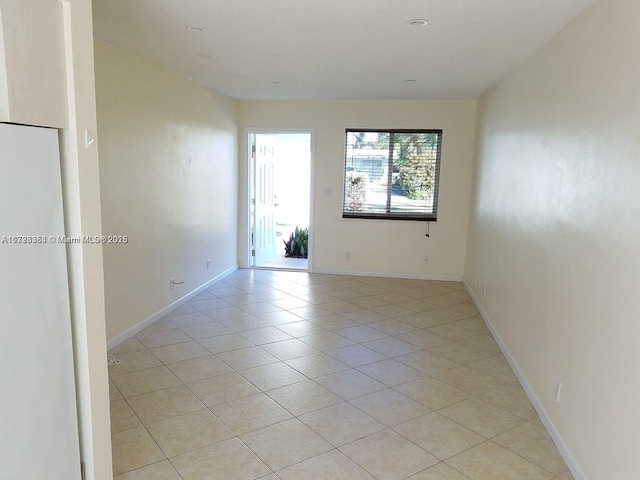 unfurnished room featuring light tile patterned floors