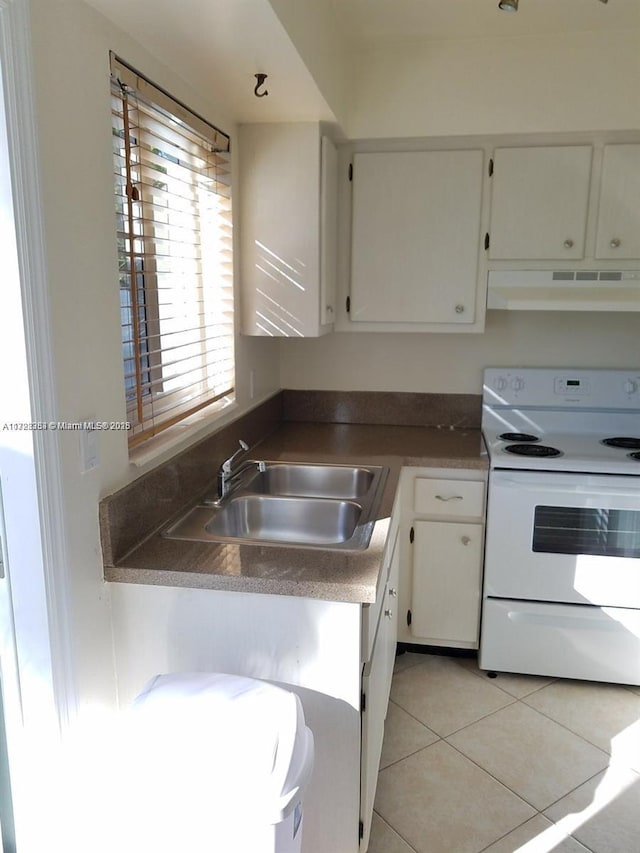 kitchen with sink, white cabinetry, white electric stove, and light tile patterned floors