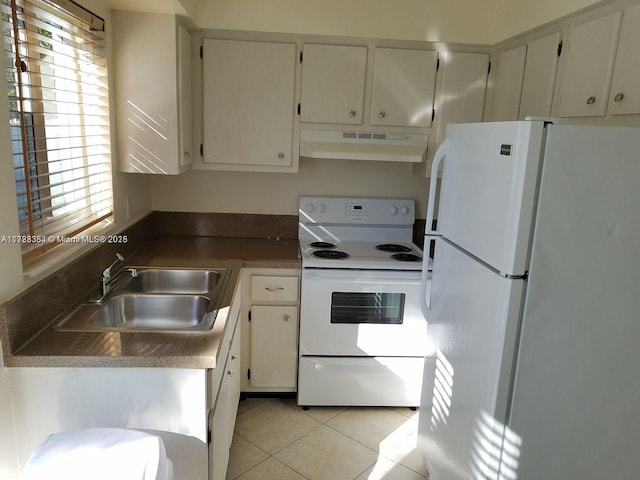 kitchen with white cabinetry, sink, light tile patterned floors, and white appliances