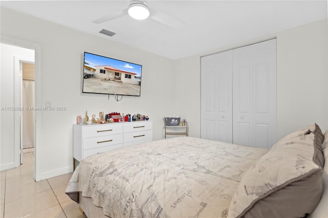 tiled bedroom with a closet and ceiling fan