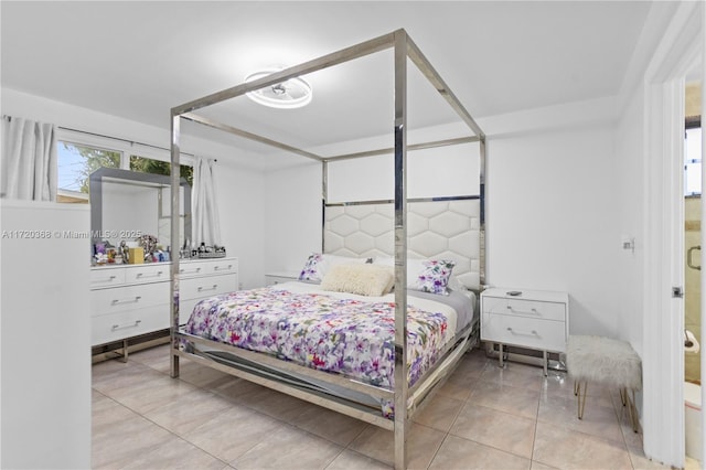 bedroom with light tile patterned floors