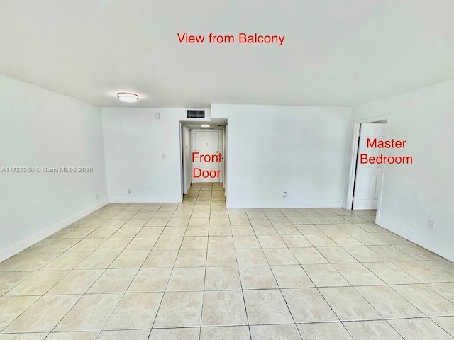 empty room featuring light tile patterned floors