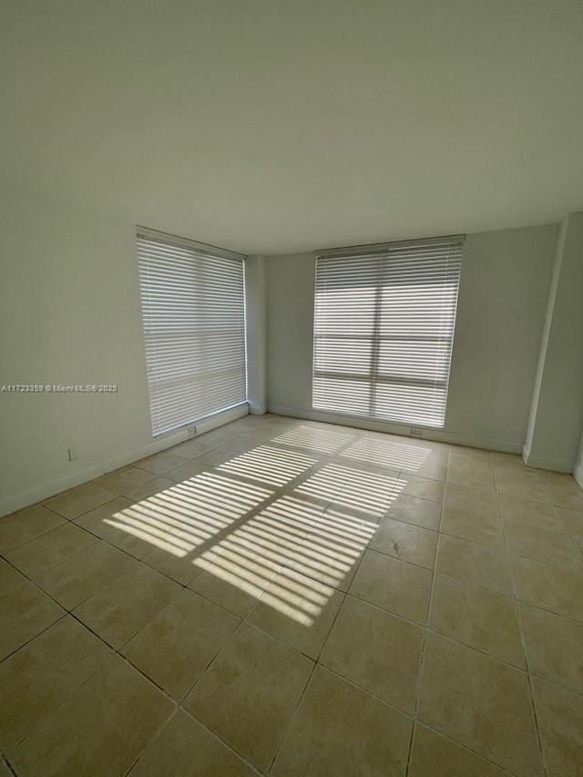 empty room featuring light tile patterned floors