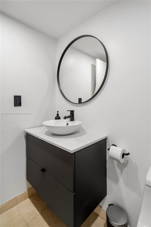 bathroom featuring tile patterned flooring and vanity