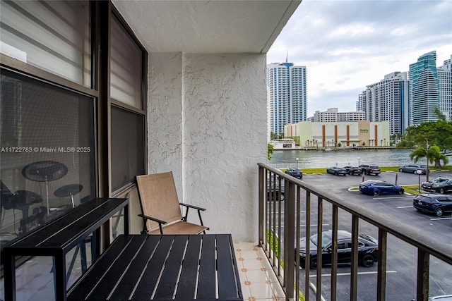 balcony featuring a water view