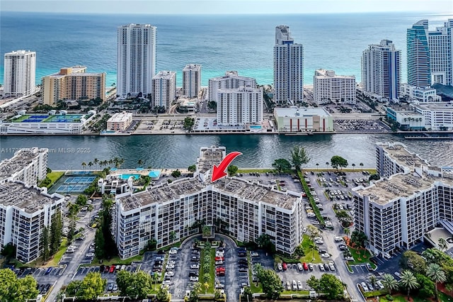 birds eye view of property with a water view