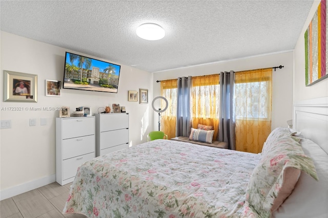 bedroom featuring a textured ceiling