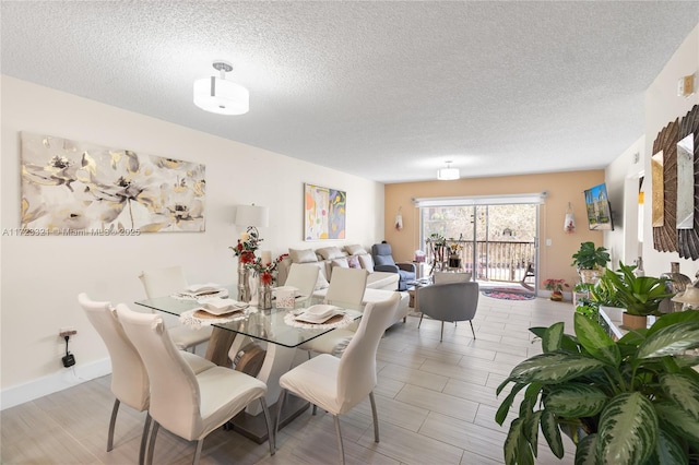 dining space featuring a textured ceiling