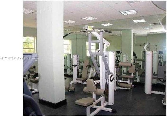 exercise room featuring a paneled ceiling