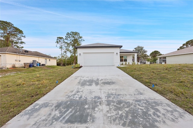 ranch-style home featuring a garage and a front lawn