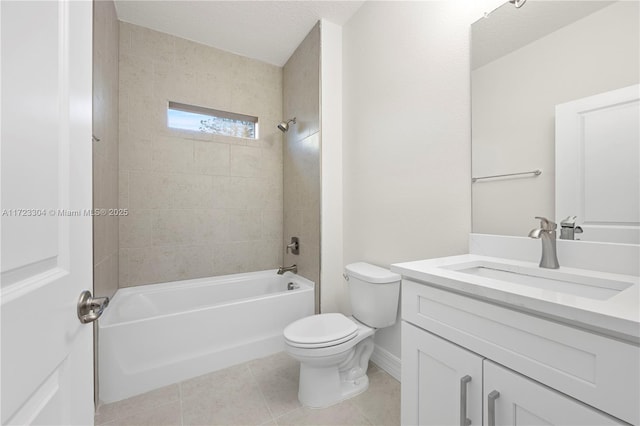 full bathroom featuring tile patterned flooring, tiled shower / bath combo, toilet, and vanity