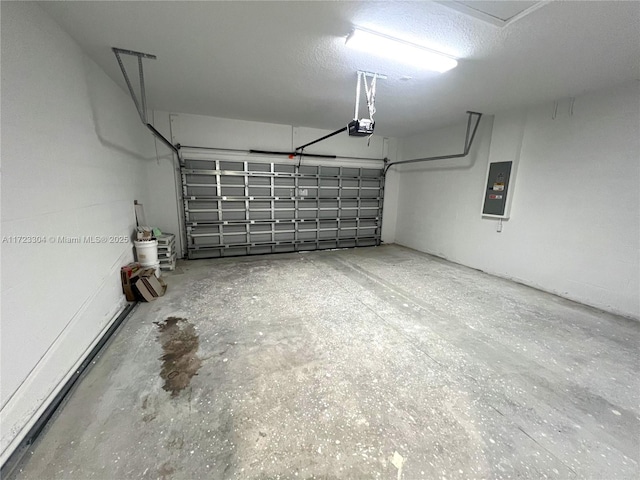 garage with electric panel and a garage door opener