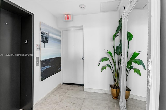 2900 NE 7th Ave Unit 908, Miami, FL 33137 - corridor featuring baseboards and elevator