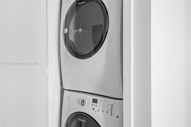 laundry room featuring stacked washer and clothes dryer