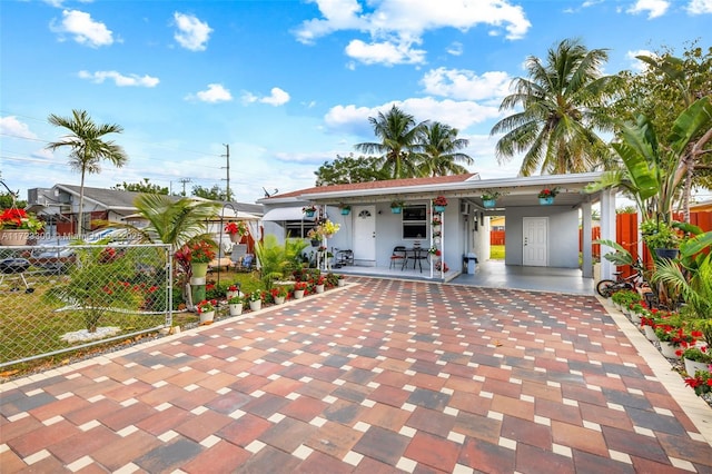 view of front of property featuring a carport and a porch