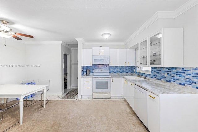 kitchen featuring white appliances, ceiling fan, sink, light tile patterned floors, and white cabinets