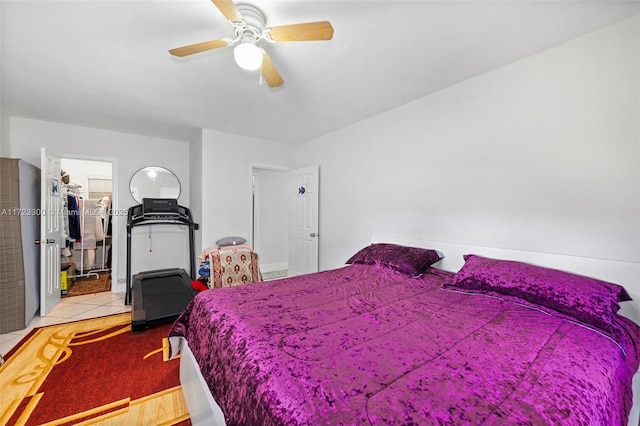 bedroom with ceiling fan and light tile patterned flooring