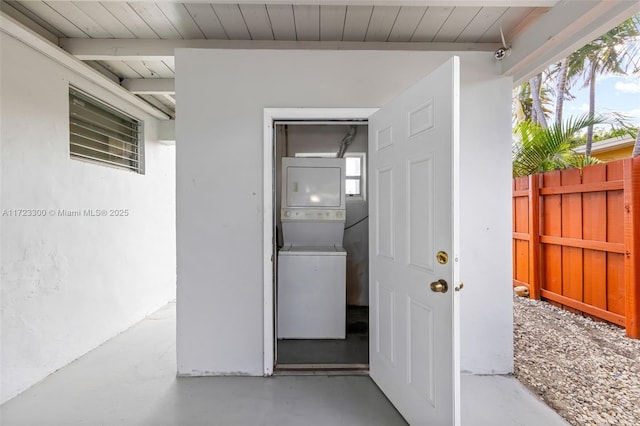 exterior space featuring stacked washer / dryer