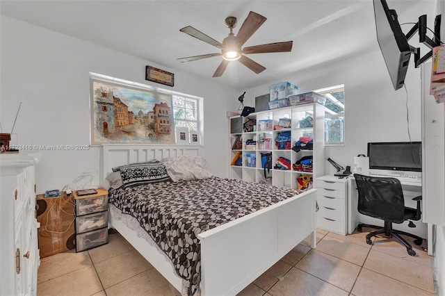 tiled bedroom with ceiling fan