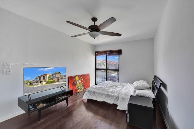 bedroom featuring ceiling fan and dark wood-type flooring