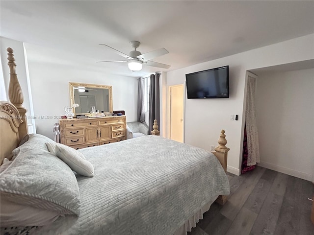 bedroom featuring ceiling fan and dark hardwood / wood-style floors