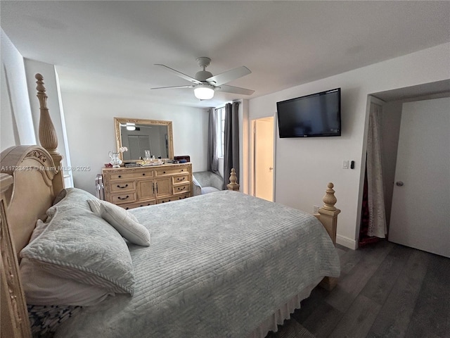 bedroom featuring ceiling fan and dark hardwood / wood-style floors