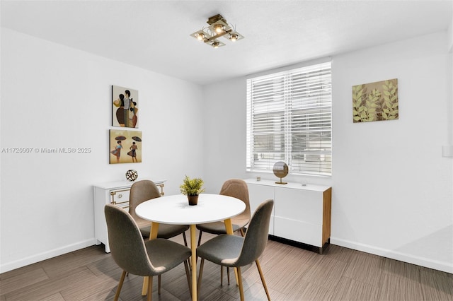 dining area featuring dark hardwood / wood-style flooring