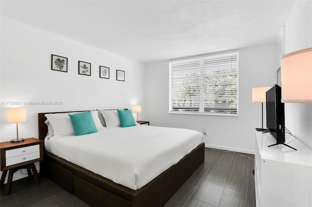 bedroom featuring dark hardwood / wood-style floors