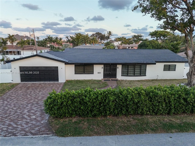 single story home with a garage