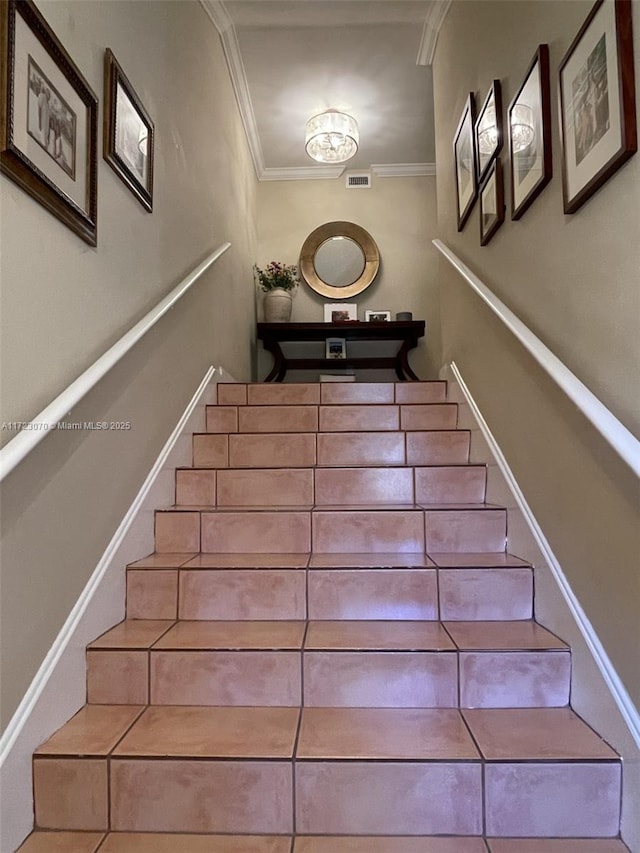 stairway with crown molding