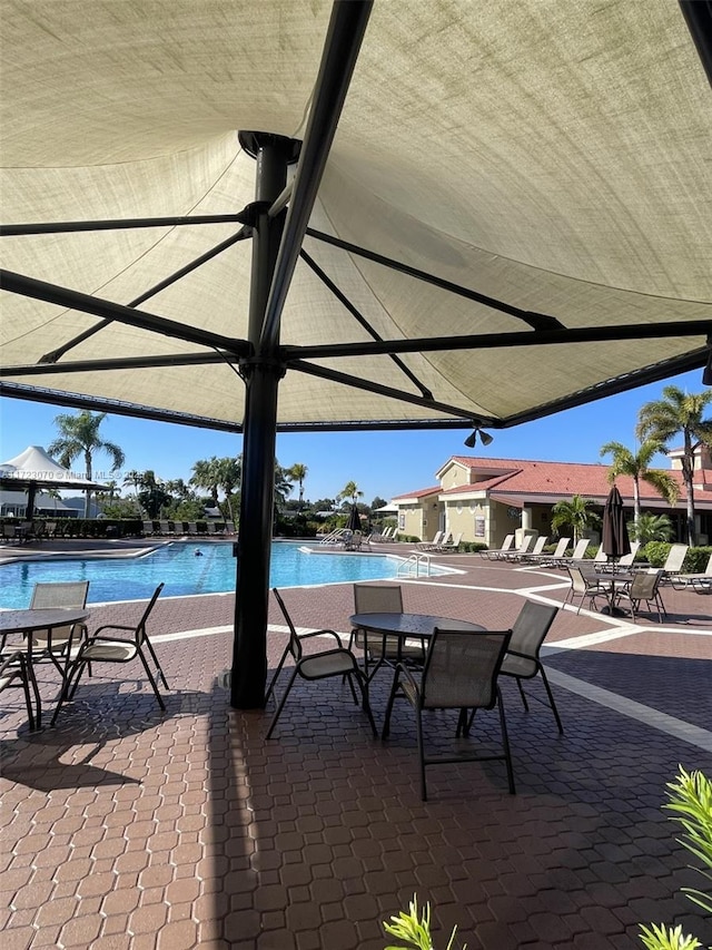 view of patio / terrace featuring a community pool