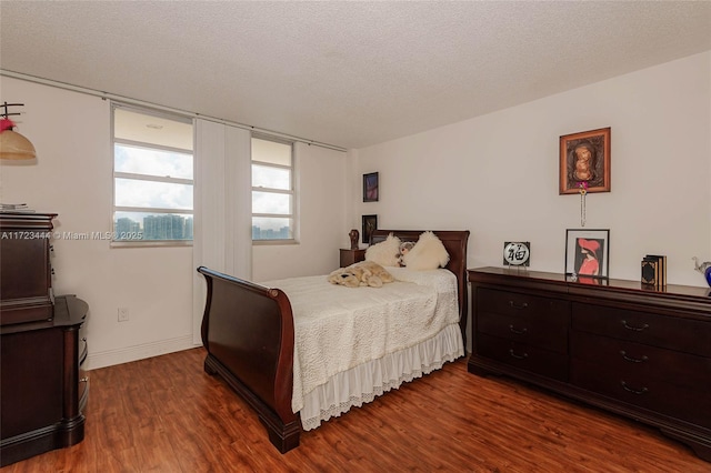 1833 S Ocean Dr Unit 1808, Hallandale Beach, FL 33009 - bedroom featuring dark wood finished floors, a textured ceiling, and baseboards