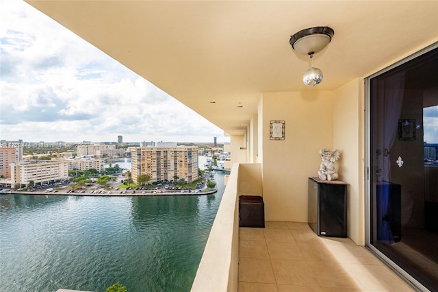 balcony featuring a water view