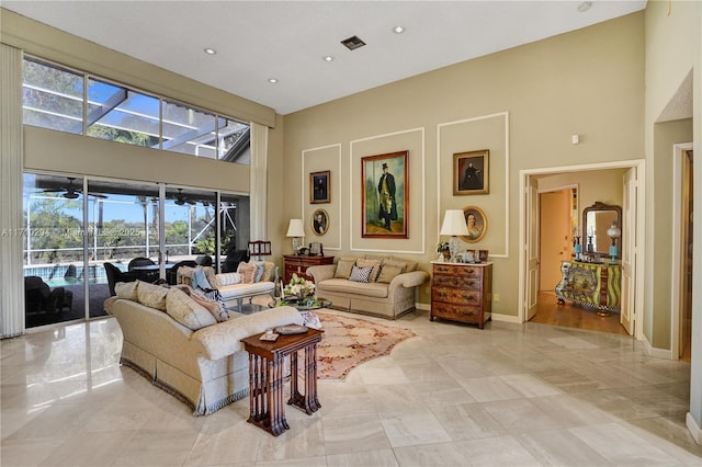 living room with a high ceiling