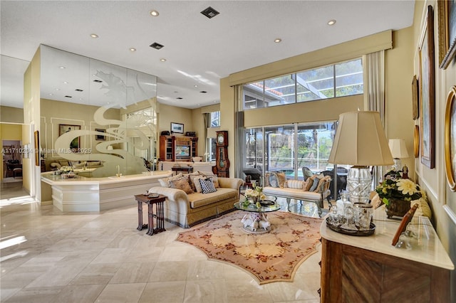 tiled living room with a high ceiling