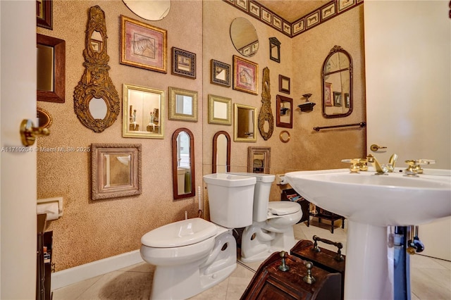 bathroom with tile patterned floors and toilet