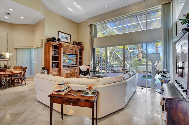 living room with a high ceiling