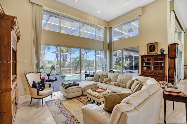 living room with a towering ceiling