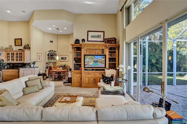 living room with a towering ceiling