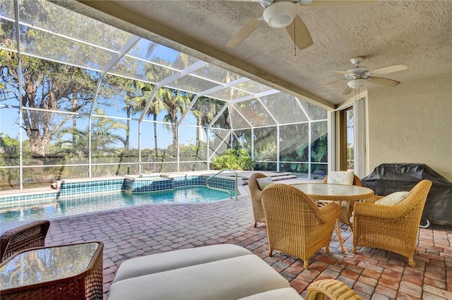 view of pool featuring ceiling fan, a lanai, and a patio