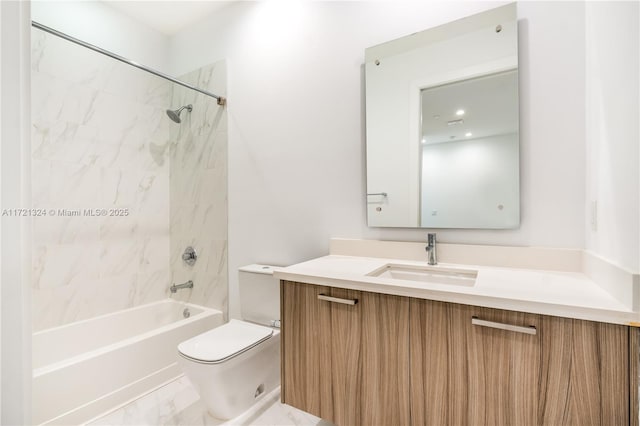 full bathroom featuring tiled shower / bath combo, vanity, and toilet